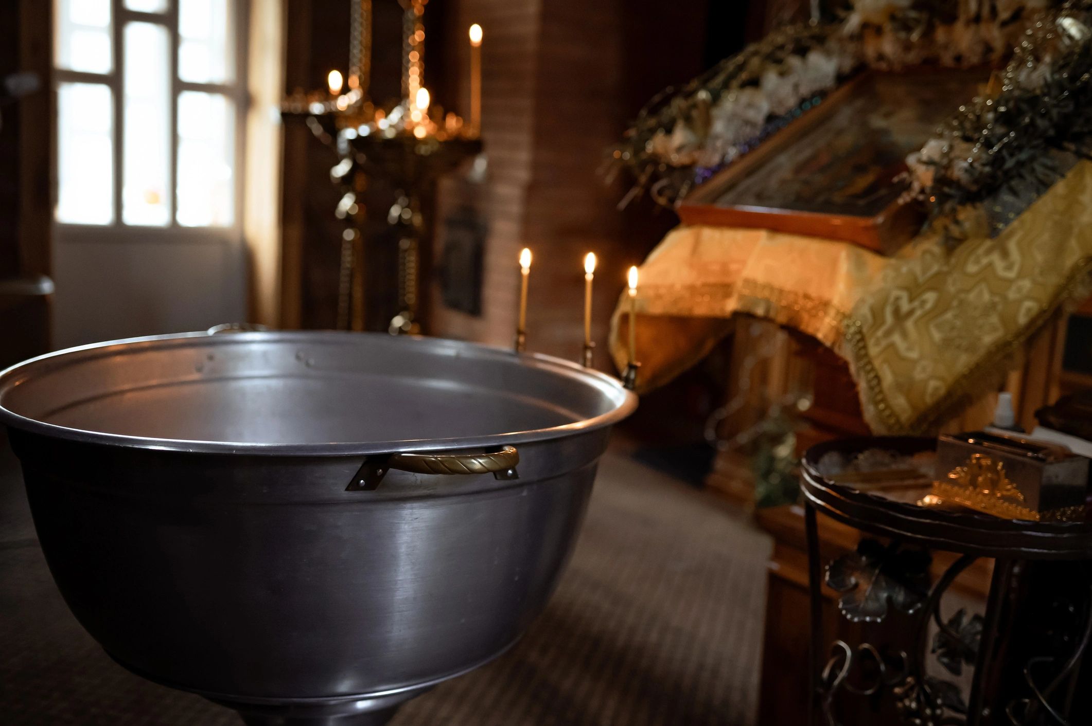 Warm church interior with candles and devotional atmosphere